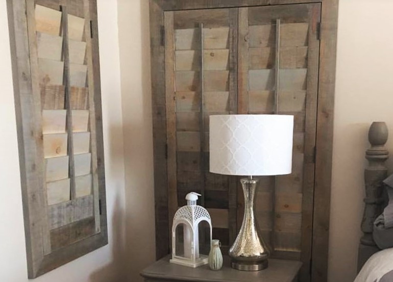 Houston bedroom with reclaimed wood shutters.